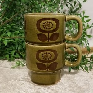 Vintage green stackable mugs with flower pattern